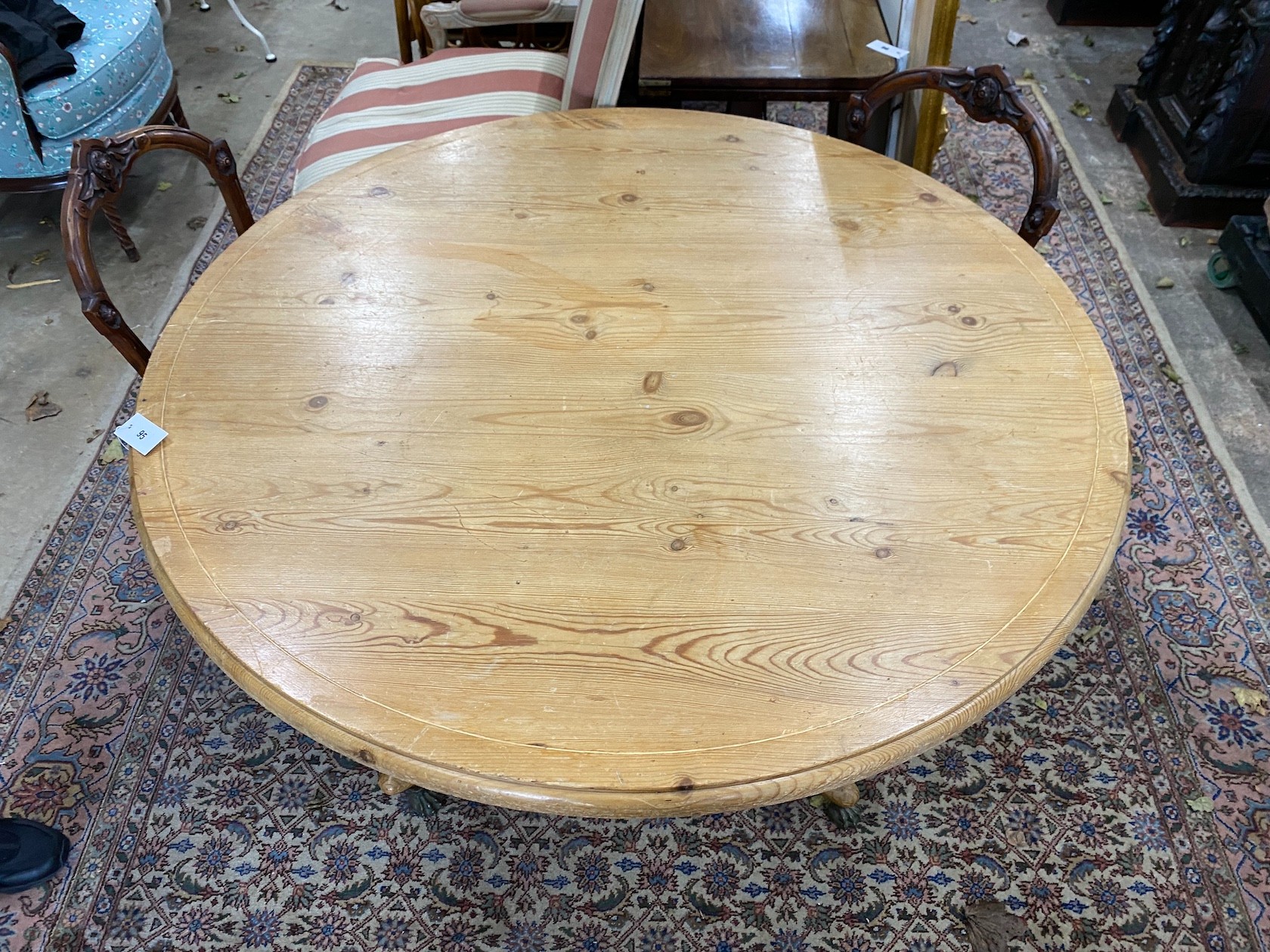 A Regency style circular pine tilt top breakfast table, diameter 120cm, height 73cm